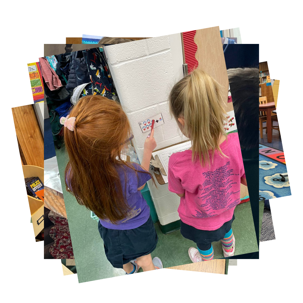 Students point to math problem clue taped to wall