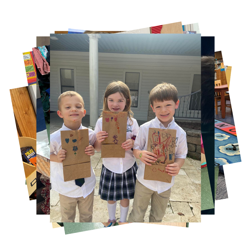 Students hold up paper bags with drawings on them
