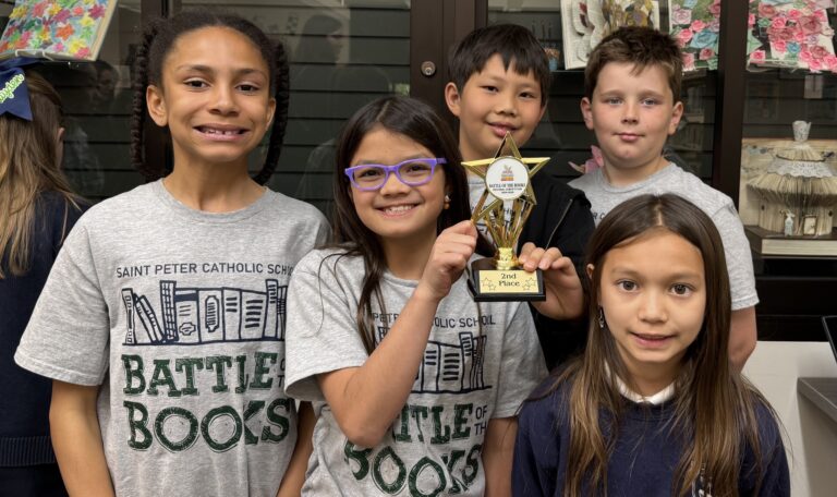 Students pose with Battle of the Books trophy