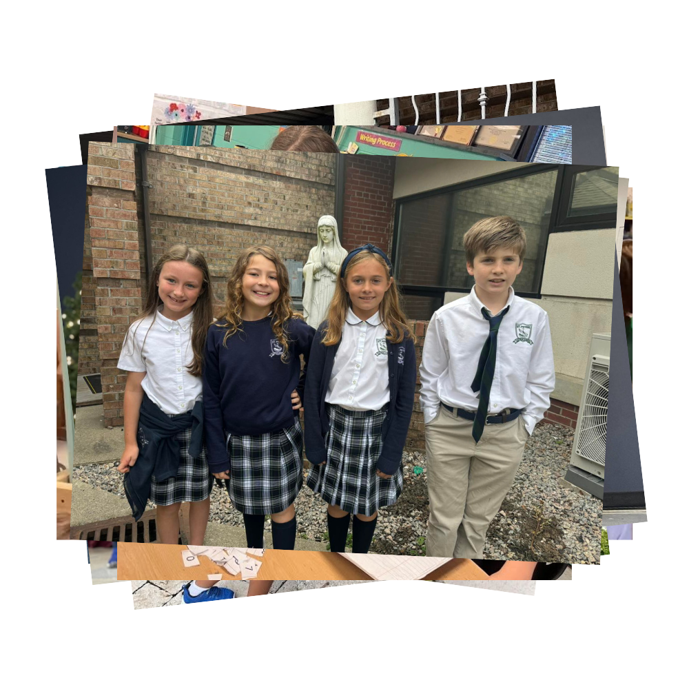 Four students in dress uniforms standing outside by Mary statue