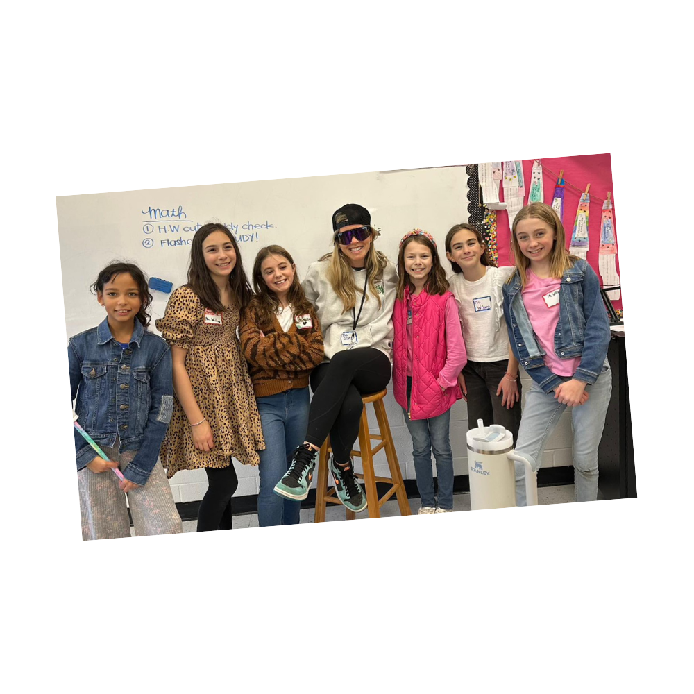 Students pose with teacher for teacher student swap day