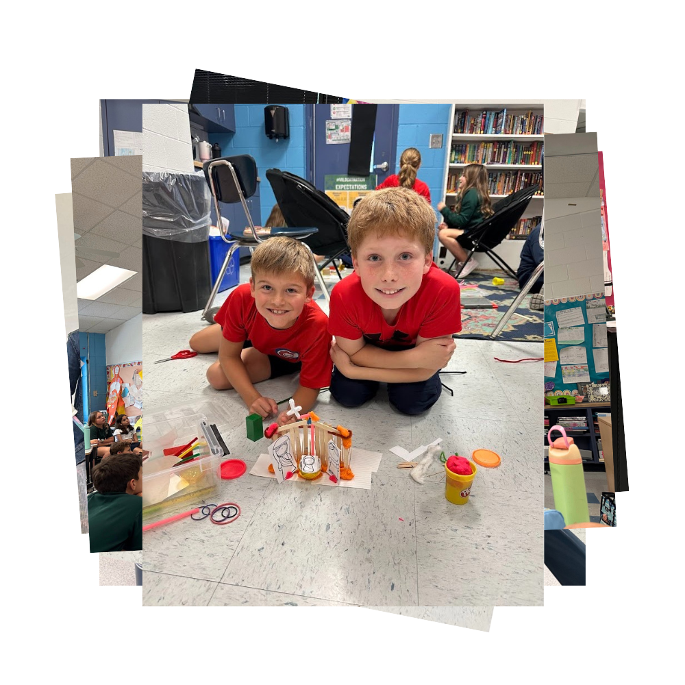 Fifth grade students pose with their nativity project made out of popsicle sticks, paper, pipe cleaners, and play dough