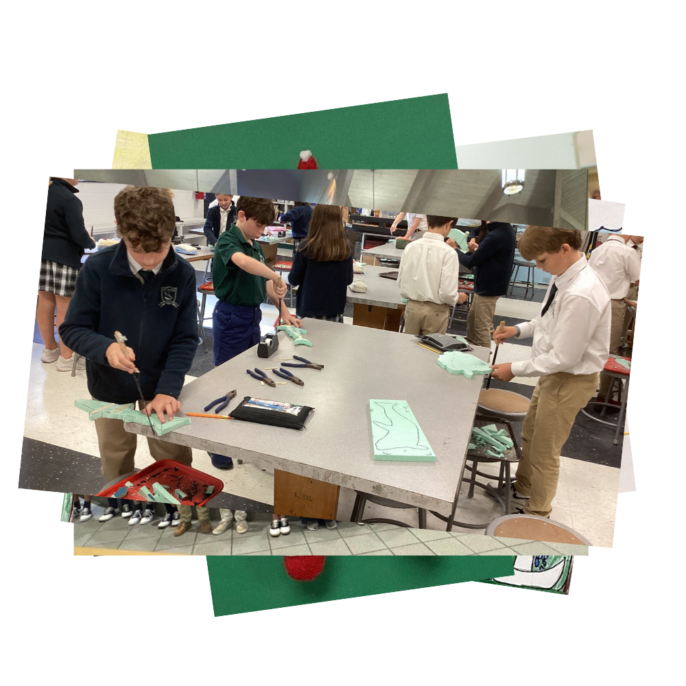 Students using craft knives to cut out Styrofoam in art class