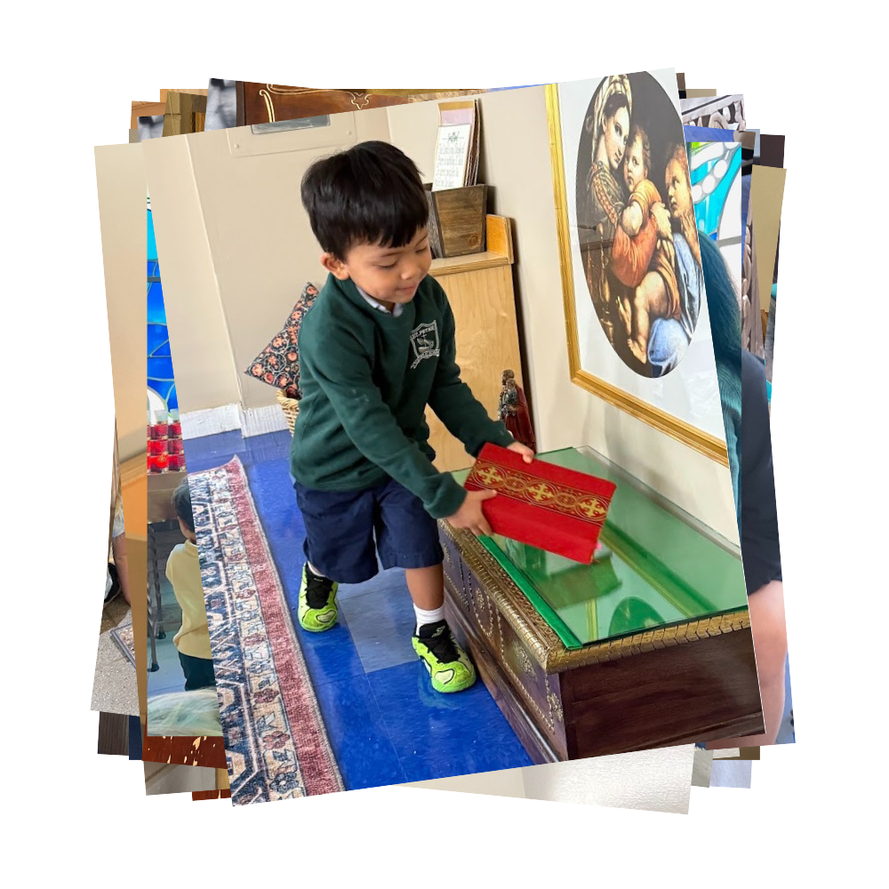 Student puts red book down on table in front of photo of the Blessed Mother with baby Jesus