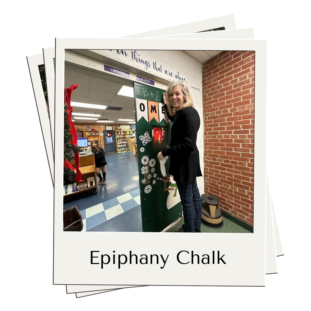 Teacher writing date on library door with caption Epiphany Chalk