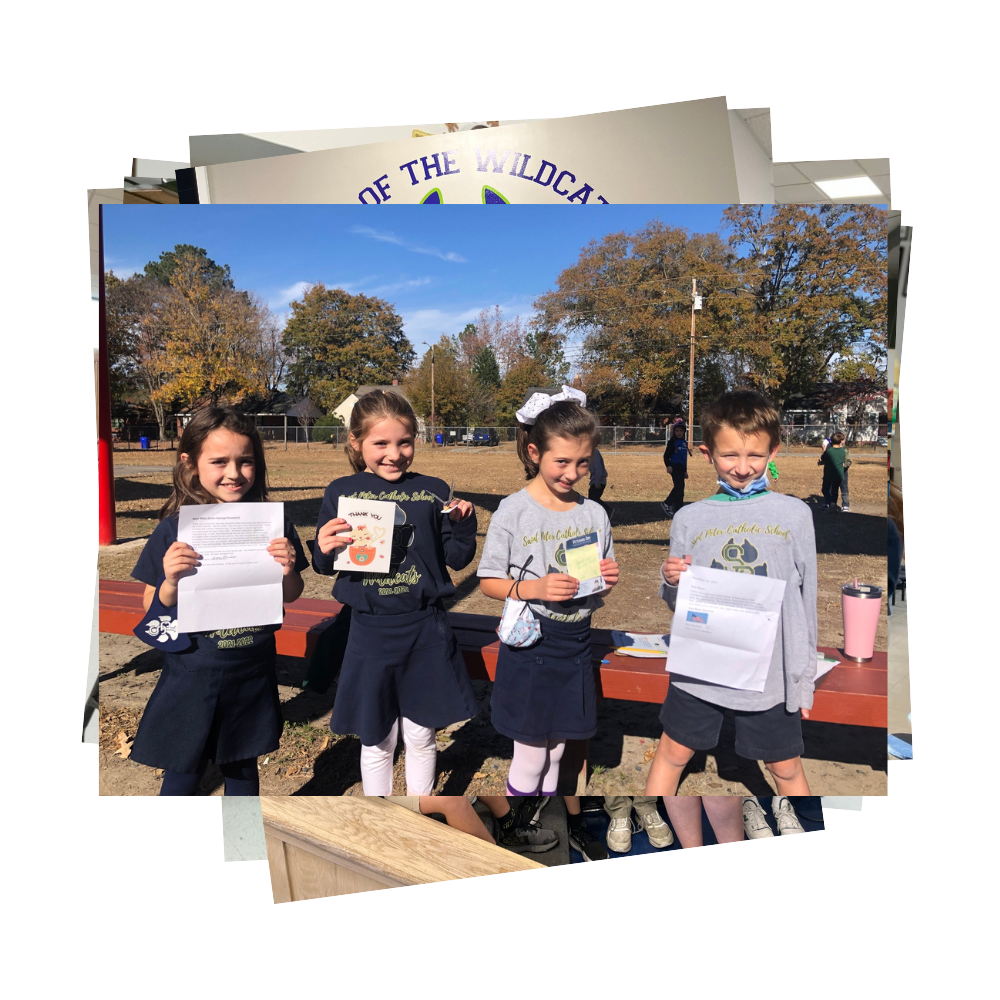 Students posing with letters from service members