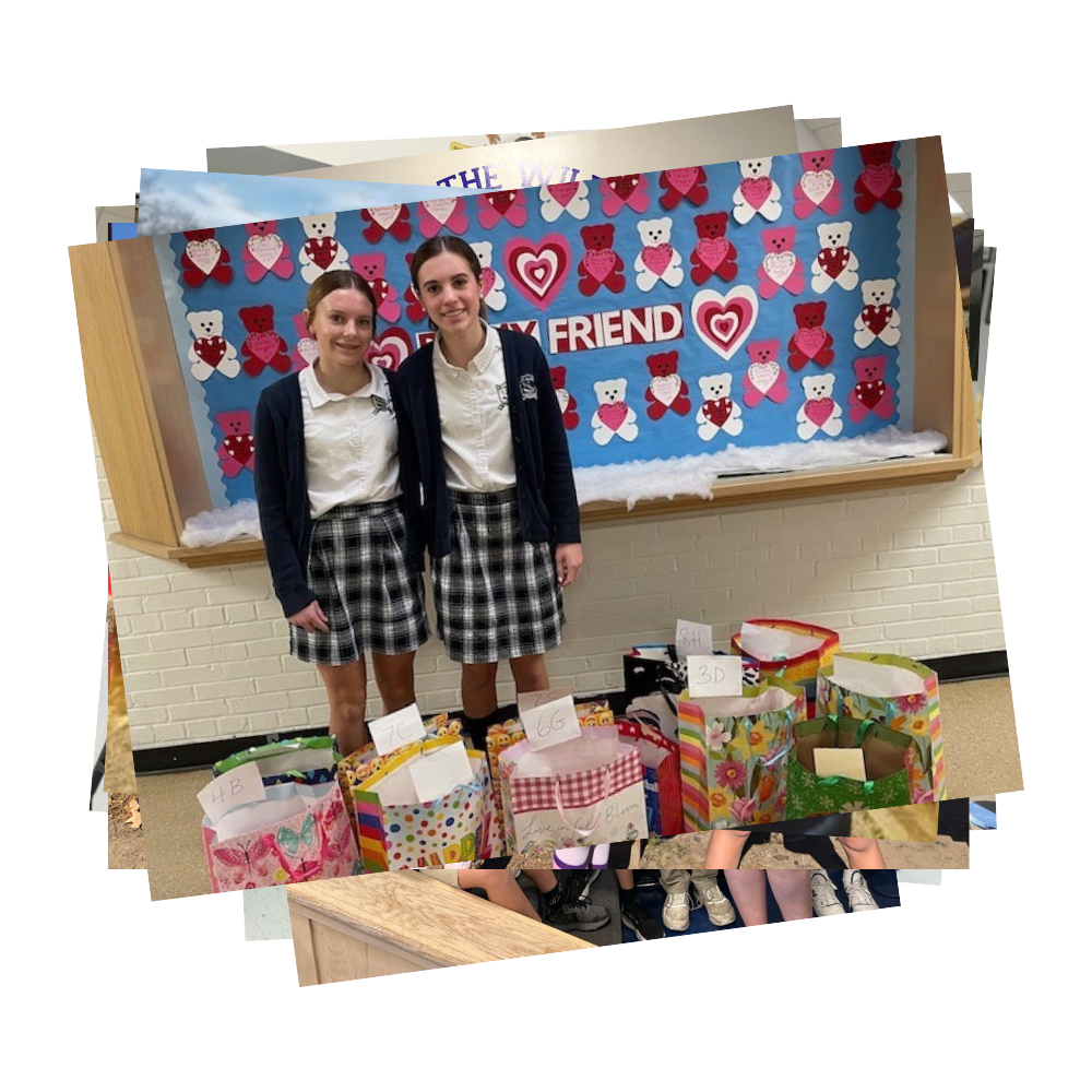 Students standing by donated gift bags and Valentine display