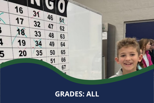 Boy smiling next to a Bingo sign with a caption that reads "Grades: All"