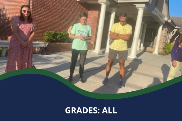 Parents praying outside school with caption that reads "Grades: All"