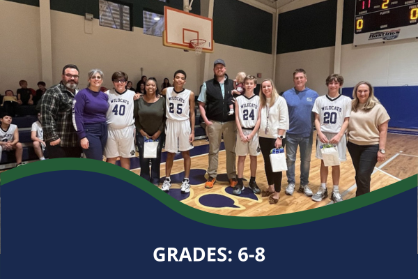 SPCS parents with basketball players during game with a caption that reads "Grades: 6-8"