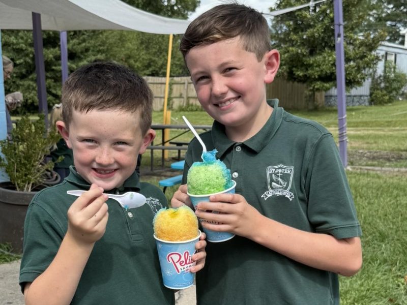 Students in uniform holding Italian ices